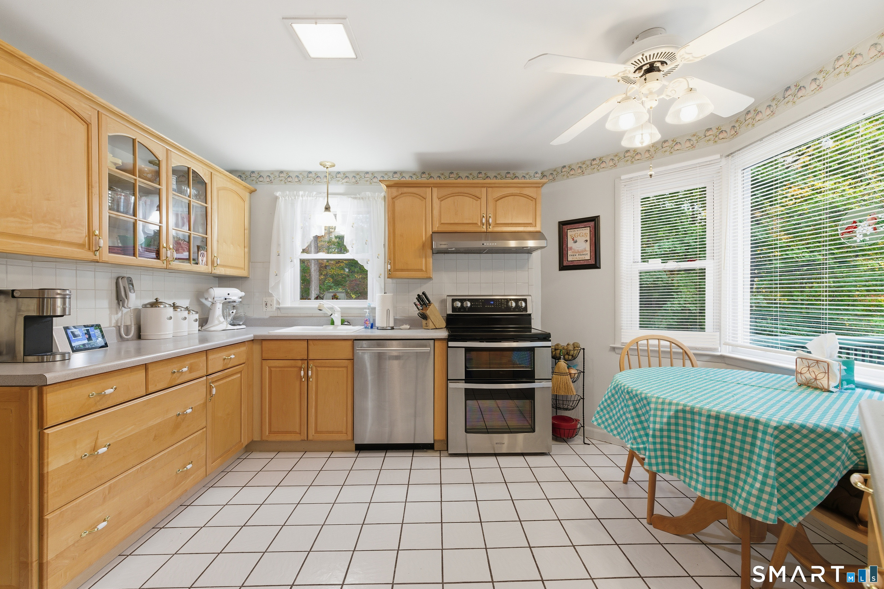 32 Richard Road Ledyard, CT 06335 - Photo 22 of 32 a kitchen with a stove a sink and a refrigerator