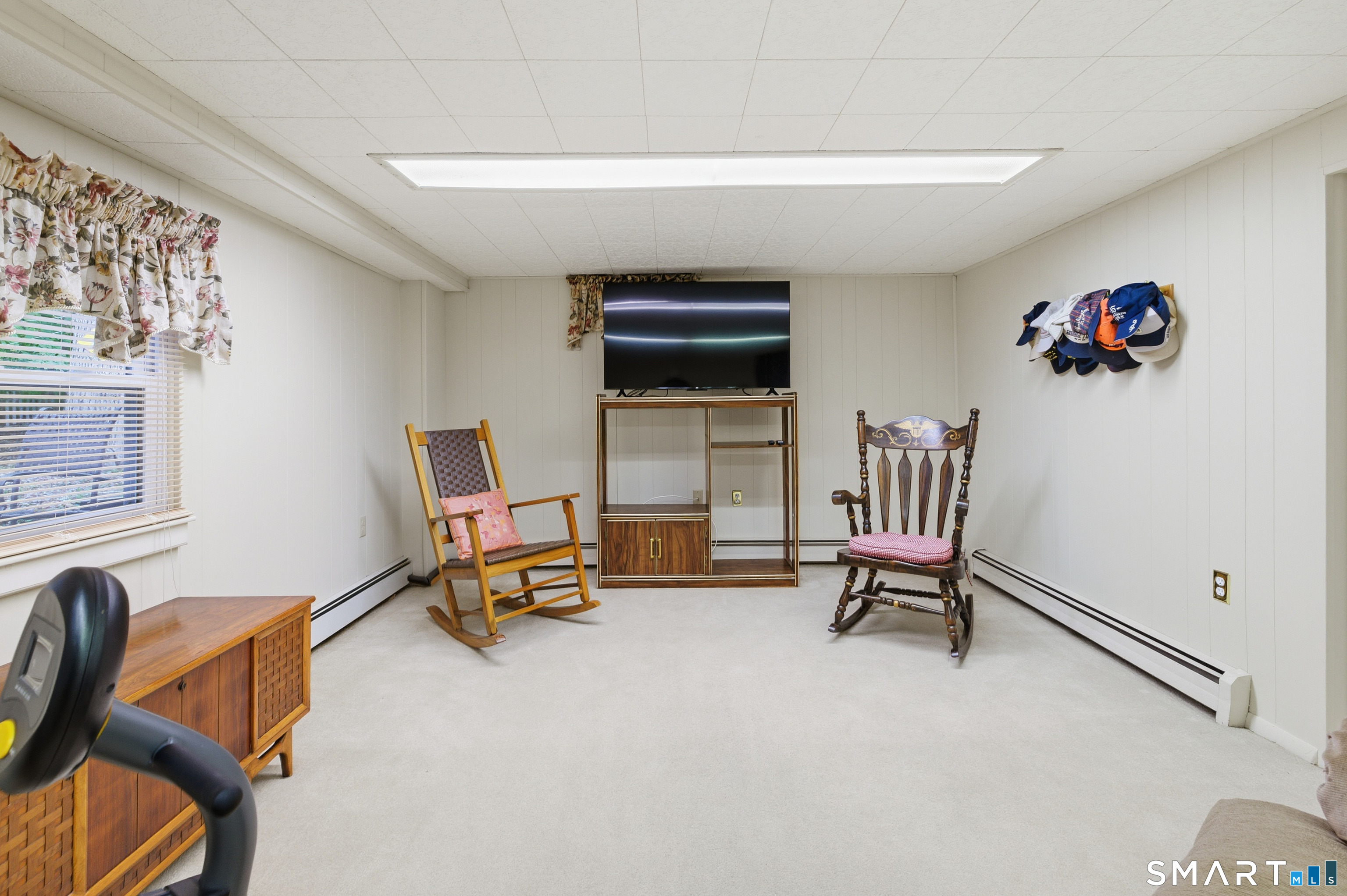 32 Richard Road Ledyard, CT 06335 - Photo 24 of 32 a living room with furniture and a gym machine
