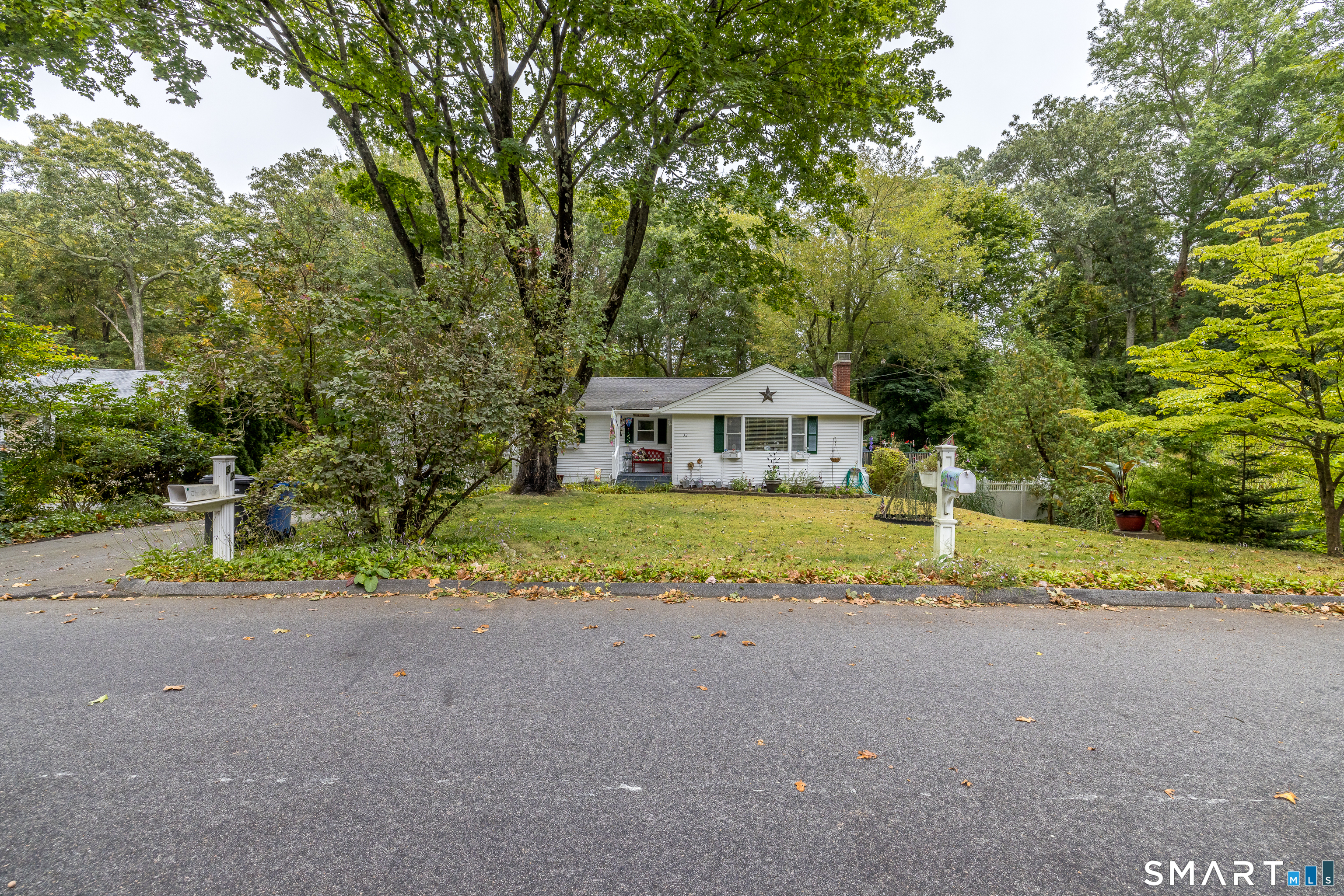 32 Richard Road Ledyard, CT 06335 - Photo 5 of 32 a view of house with outdoor space and trees around