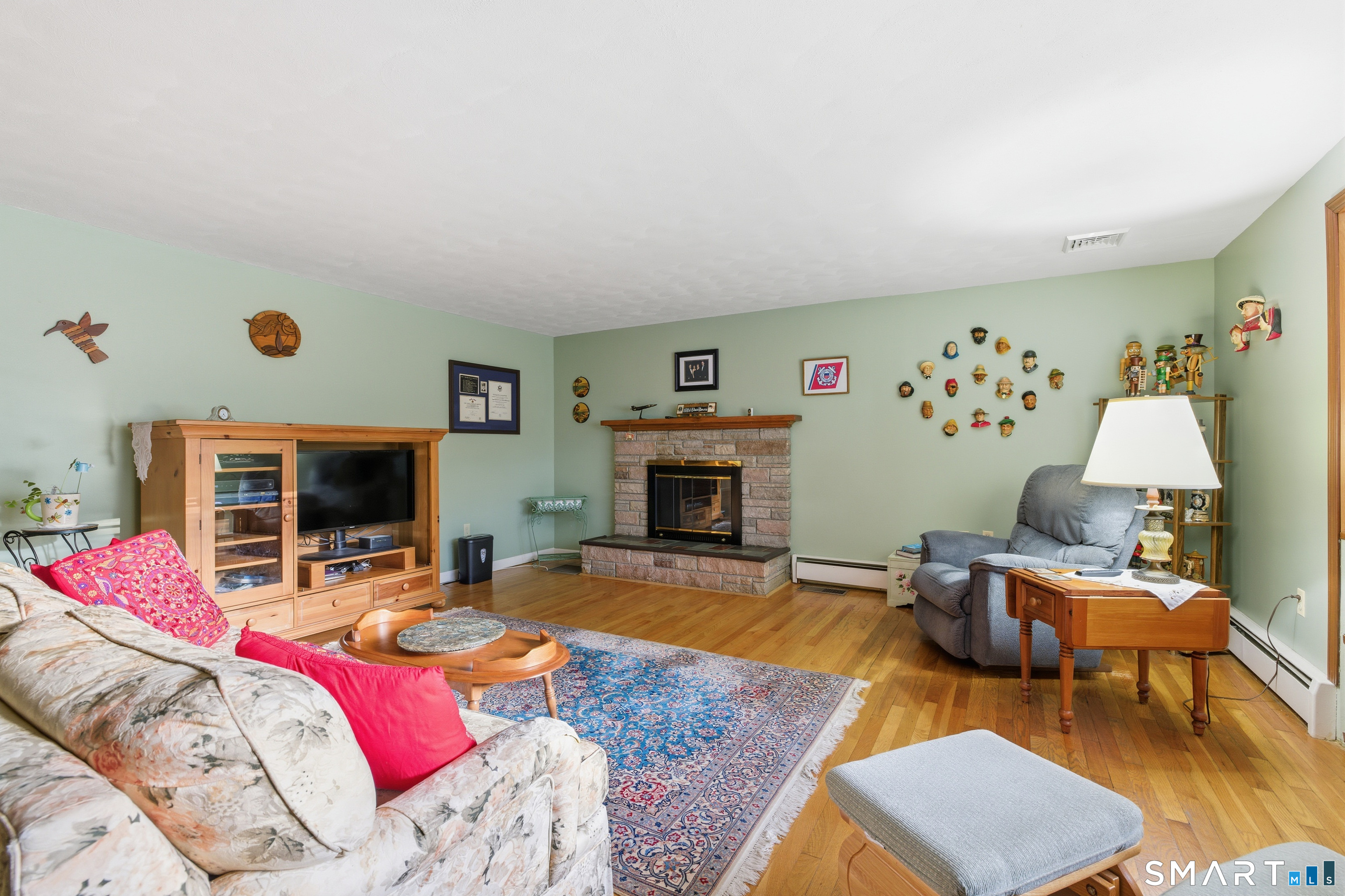 32 Richard Road Ledyard, CT 06335 - Photo 9 of 32 a bedroom with furniture and a fireplace