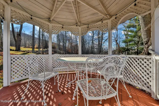 a view of a chairs and table in the patio