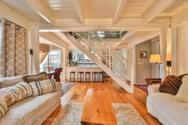 a living room with furniture and a rug