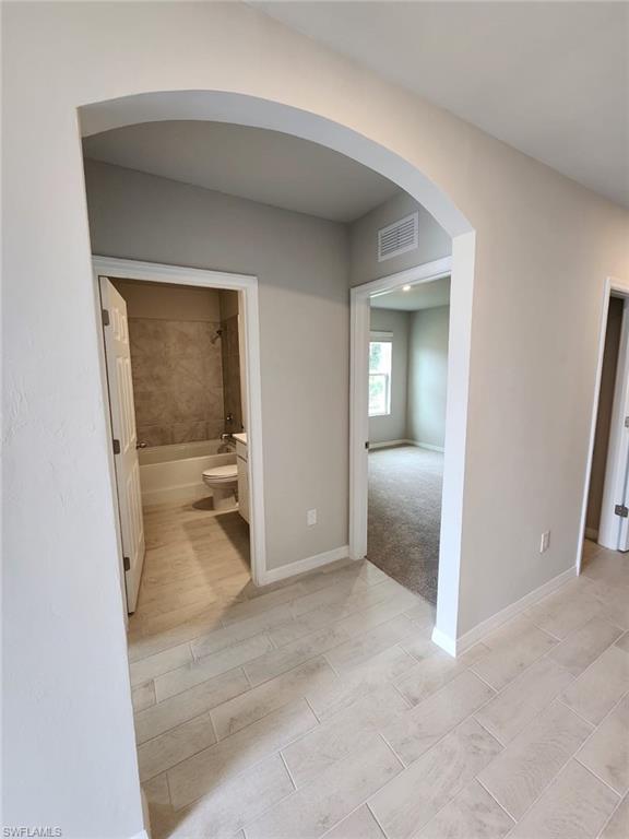 2320 Thurlow Street Alva, FL 33920 - Photo 10 of 11 an empty room with a bathroom mirror