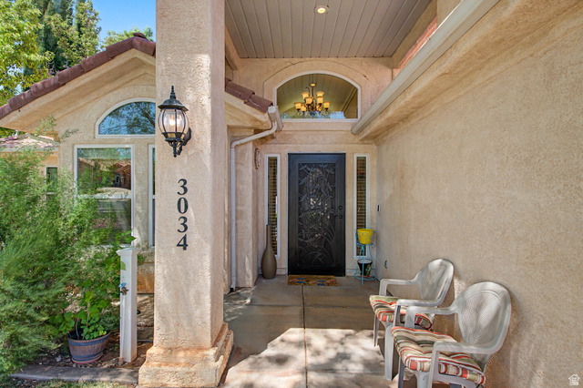 3034 Swiss Drive Santa Clara, UT 84765 - Photo 11 of 59 Stucco exterior with arched windows and a covered entry