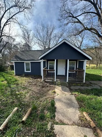 front view of a house with a yard