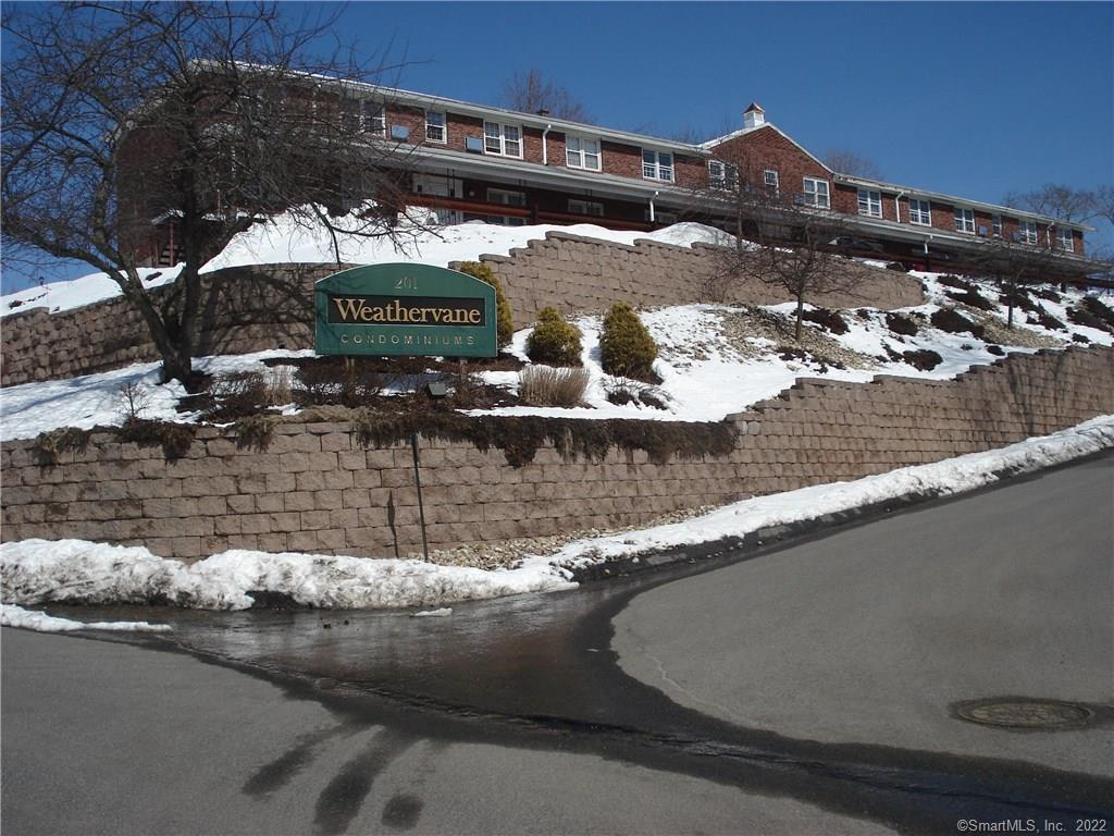 201 Regan Road, Unit 17C Vernon, CT 06066 - Photo 1 of 1 a view of a house with a yard