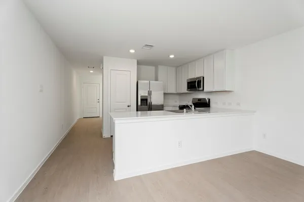 a view of a kitchen with microwave