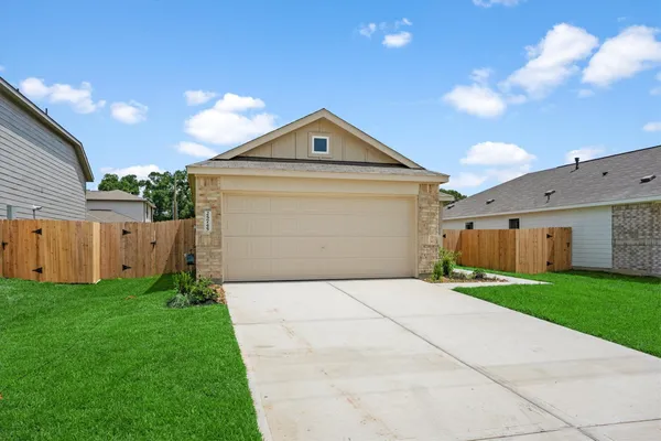 a front view of a house with yard