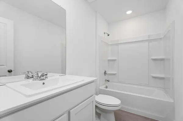 a bathroom with a sink toilet and a bathtub