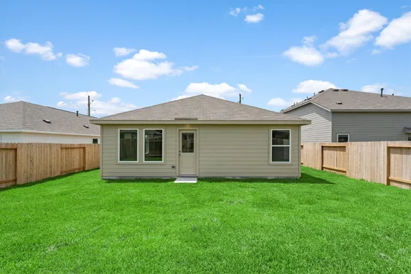 a view of a house with a yard and a garden