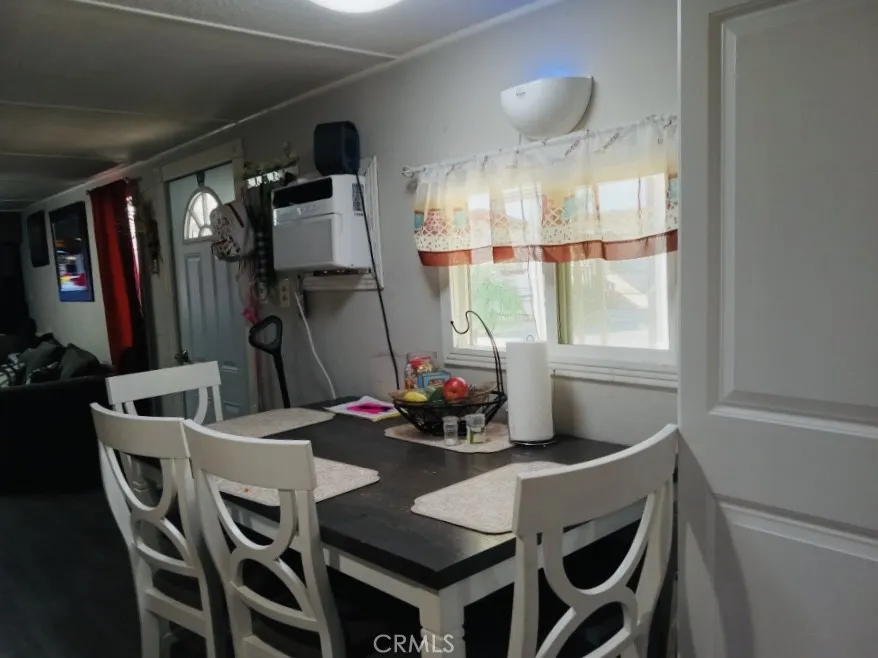 26235 East 9th, Unit 36 Highland, CA 92346 - Photo 2 of 15 a dining room with furniture and window