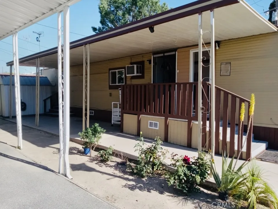 26235 East 9th, Unit 36 Highland, CA 92346 - Photo 6 of 15 a view of a porch with furniture