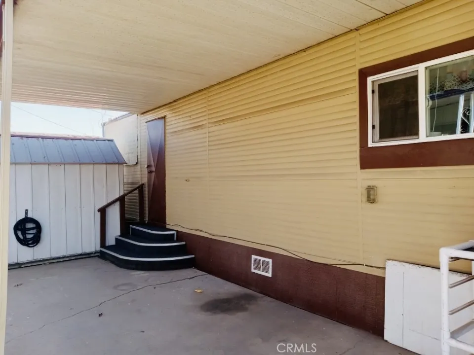 26235 East 9th, Unit 36 Highland, CA 92346 - Photo 7 of 15 a view of entryway with workspace