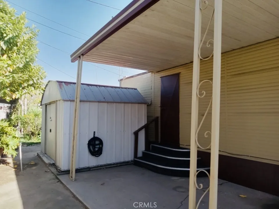 26235 East 9th, Unit 36 Highland, CA 92346 - Photo 8 of 15 a view of a house with a door