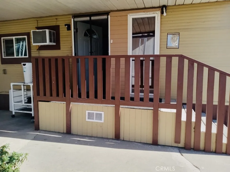26235 East 9th, Unit 36 Highland, CA 92346 - Photo 10 of 15 a view of a house with wooden fence