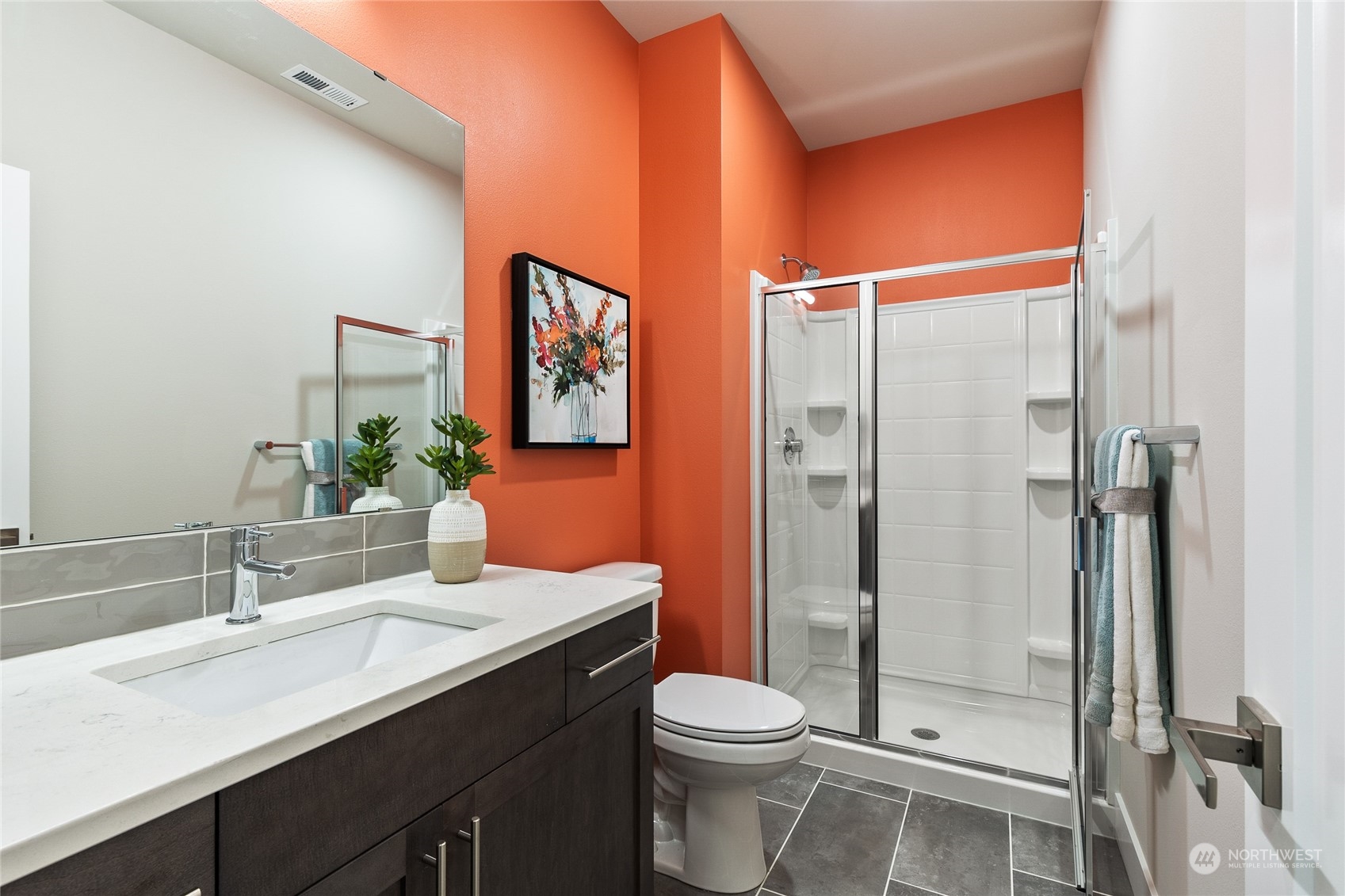 23 177th St S West Bothell, WA 98012 - Photo 9 of 32 a bathroom with a toilet a sink and shower