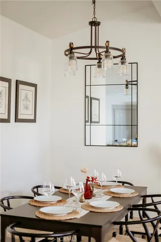 a view of a room with furniture and wooden floor