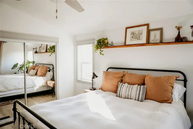 a view of a patio with a table chairs and a swimming pool
