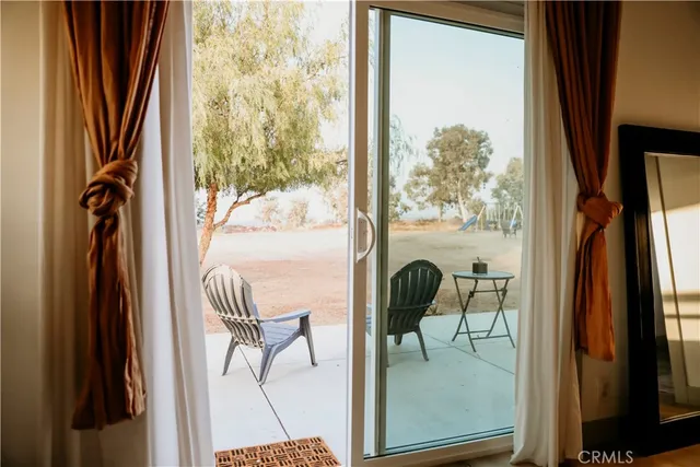 a bedroom with a bed and a potted plant