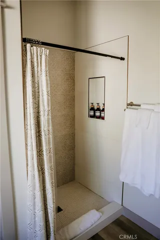 a bedroom with a bed and a lamp on table