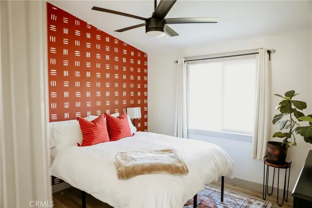 a patio with a table and chairs under an umbrella