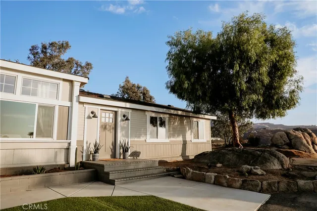 a view of a lake with a house in the background