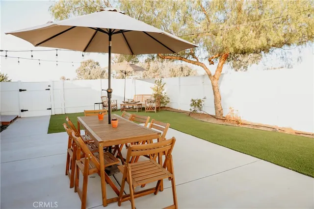 a front view of a house with a mountain