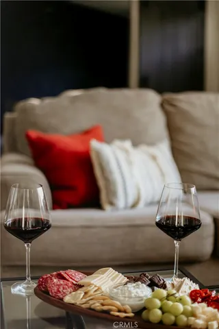 a kitchen with stainless steel appliances granite countertop a table chairs stove a sink dishwasher and a refrigerator