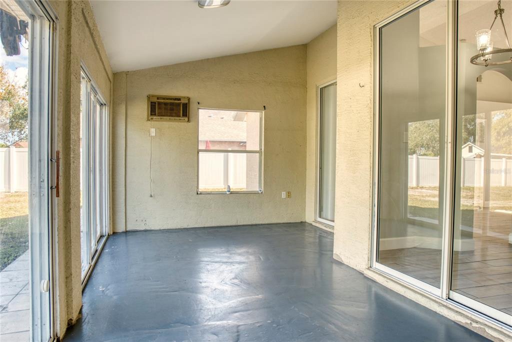1447 Kingston Way Kissimmee, FL 34744 - Photo 20 of 24 a view of a room with wooden floor and windows