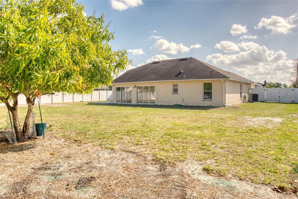 1447 Kingston Way Kissimmee, FL 34744 - Photo 21 of 24 a view of a house with a yard