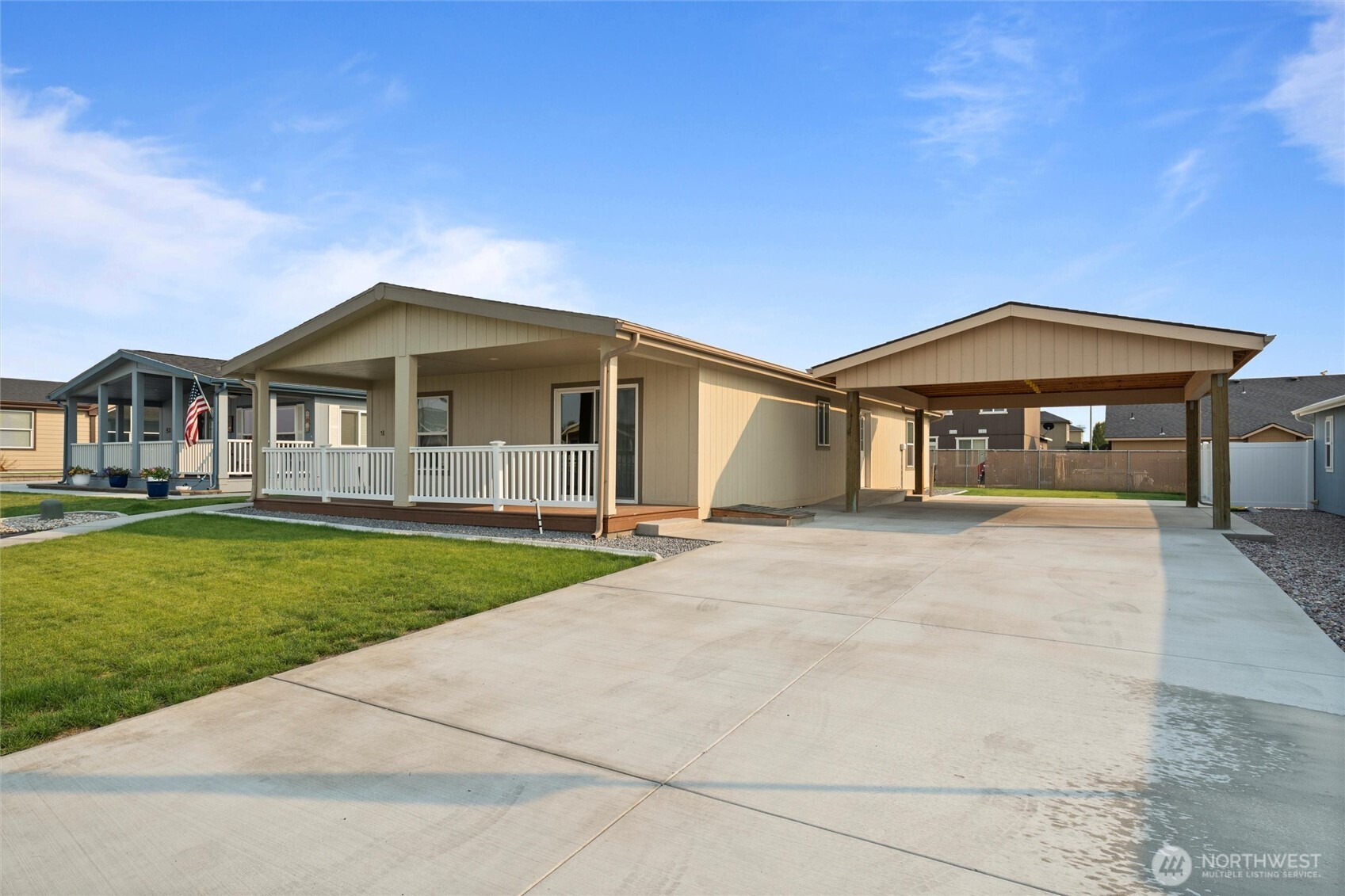 1701 Burr Avenue, Unit 51 Moses Lake, WA 98837 - Photo 1 of 35 a front view of a house with a yard