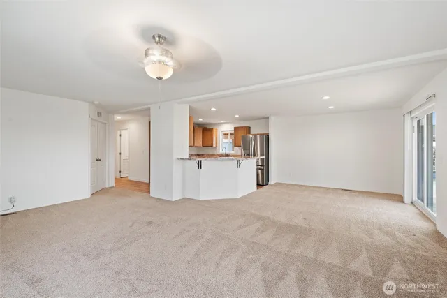 a view of a livingroom with a kitchen