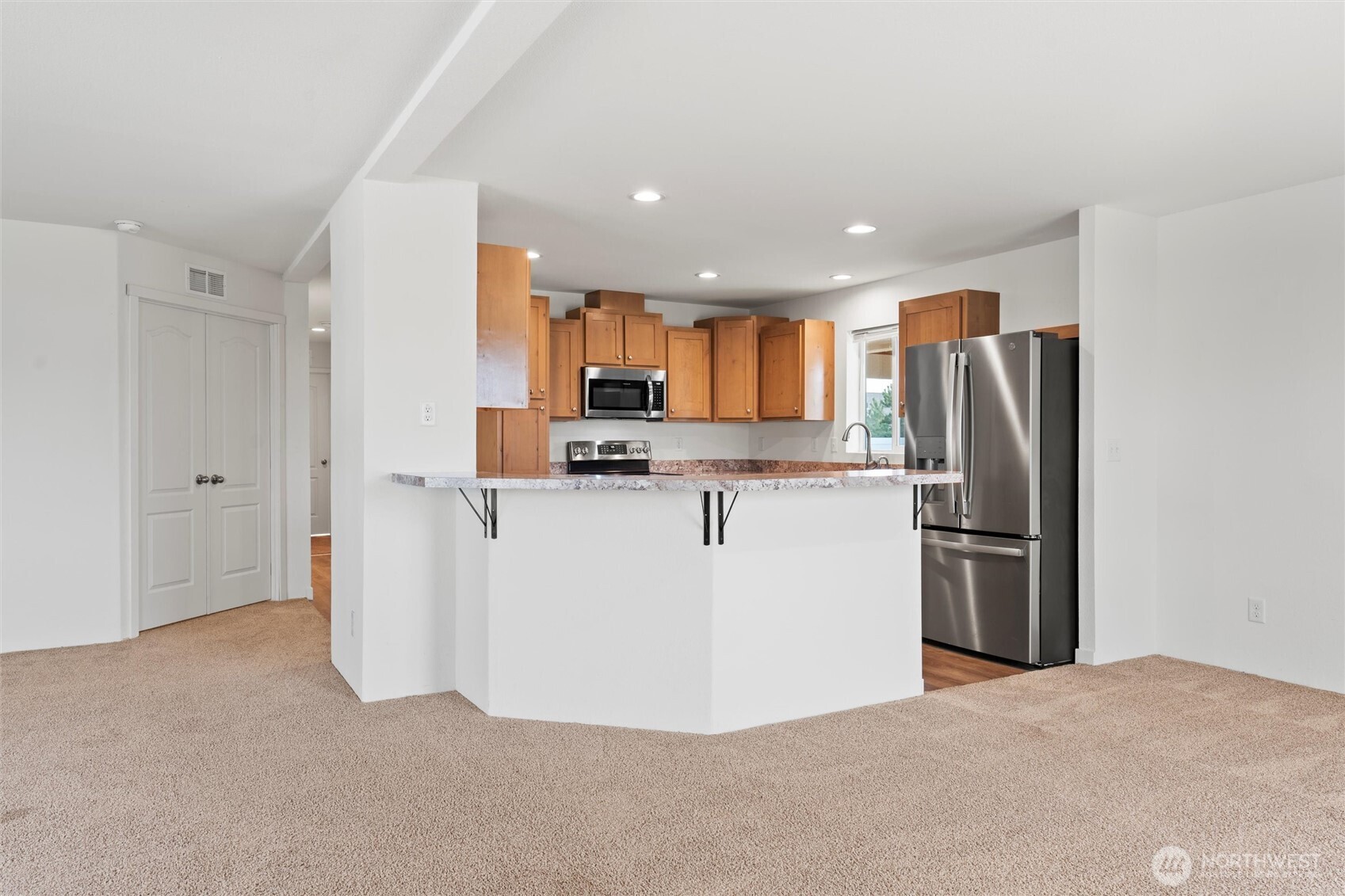 1701 Burr Avenue, Unit 51 Moses Lake, WA 98837 - Photo 13 of 35 a view of kitchen with refrigerator stove microwave and refrigerator