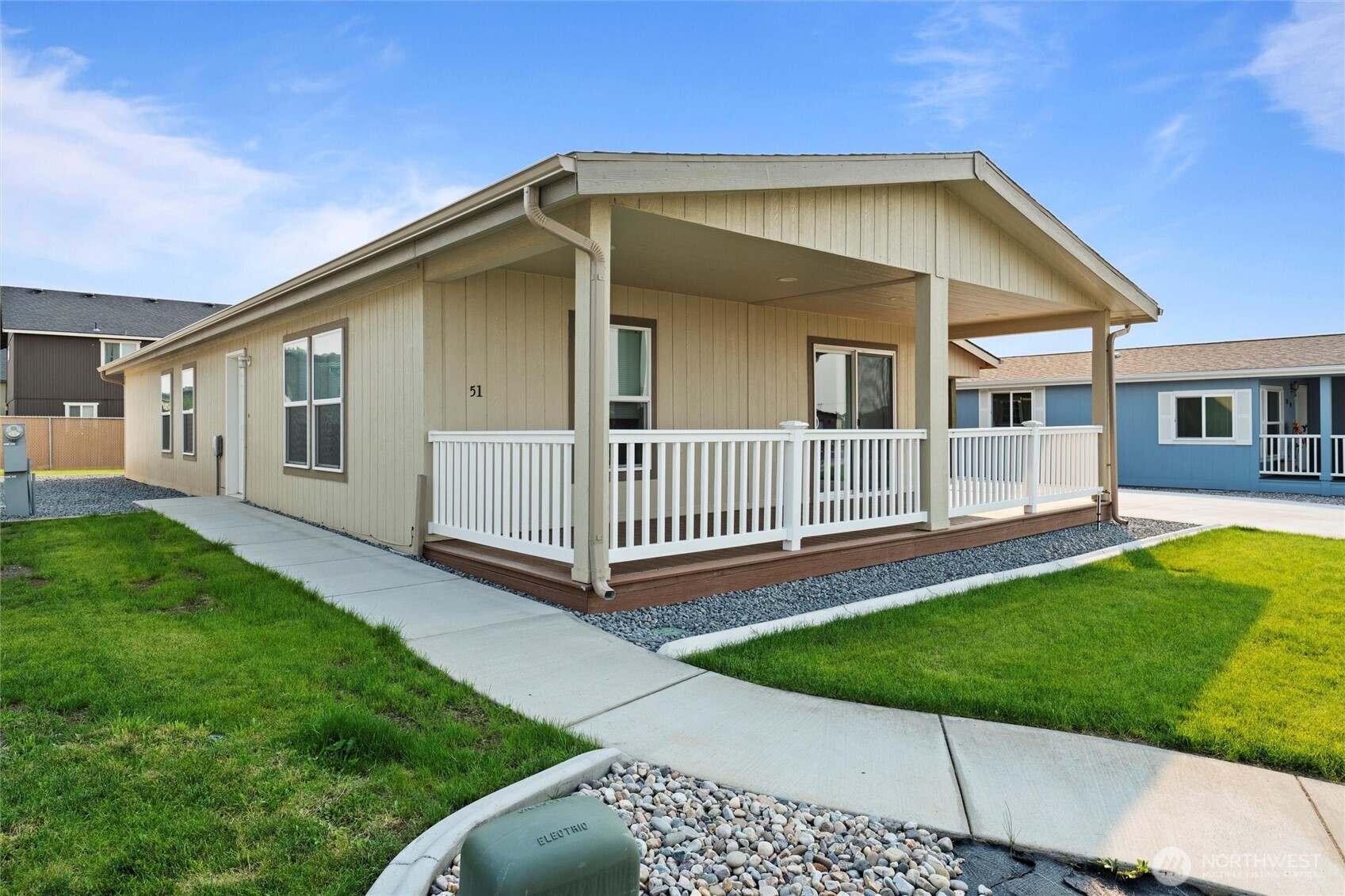 1701 Burr Avenue, Unit 51 Moses Lake, WA 98837 - Photo 2 of 35 a view of a house with a yard