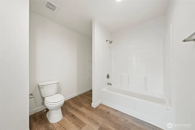 a bathroom with a toilet a sink and a bathtub