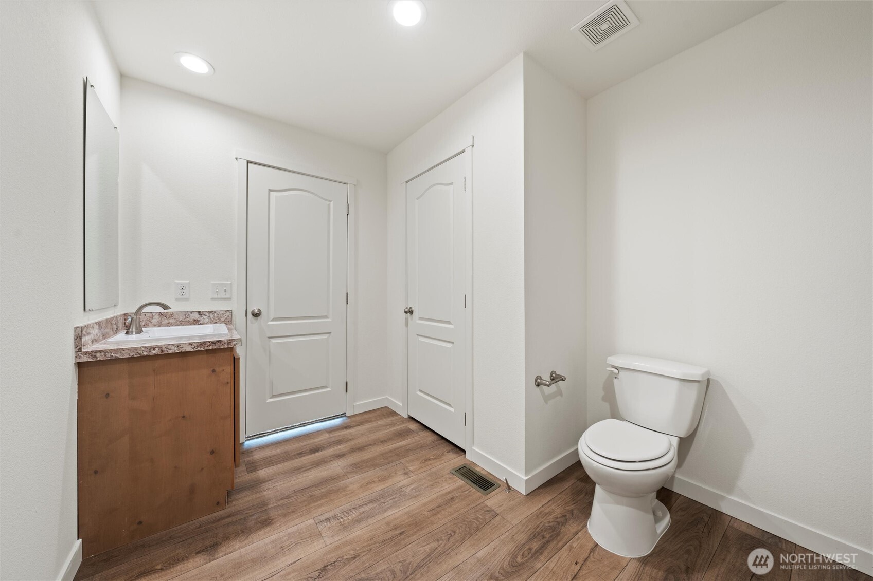 1701 Burr Avenue, Unit 51 Moses Lake, WA 98837 - Photo 34 of 35 a view of bathroom with a toilet sink and a mirror