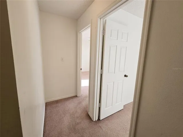 a view of a hallway with closet area