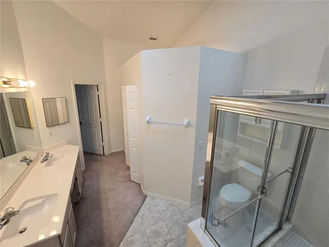 a bathroom with a shower and a mirror