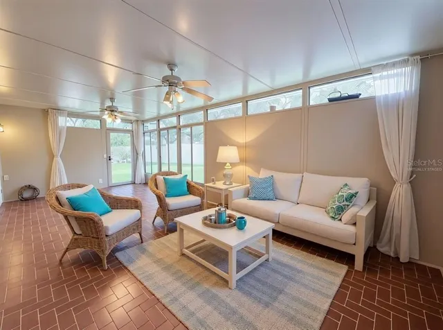 a living room with furniture and a rug