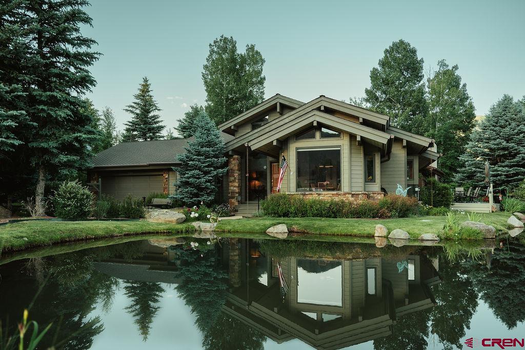 104 River Run Durango, CO 81301 - Photo 1 of 34 a front view of a house with garden