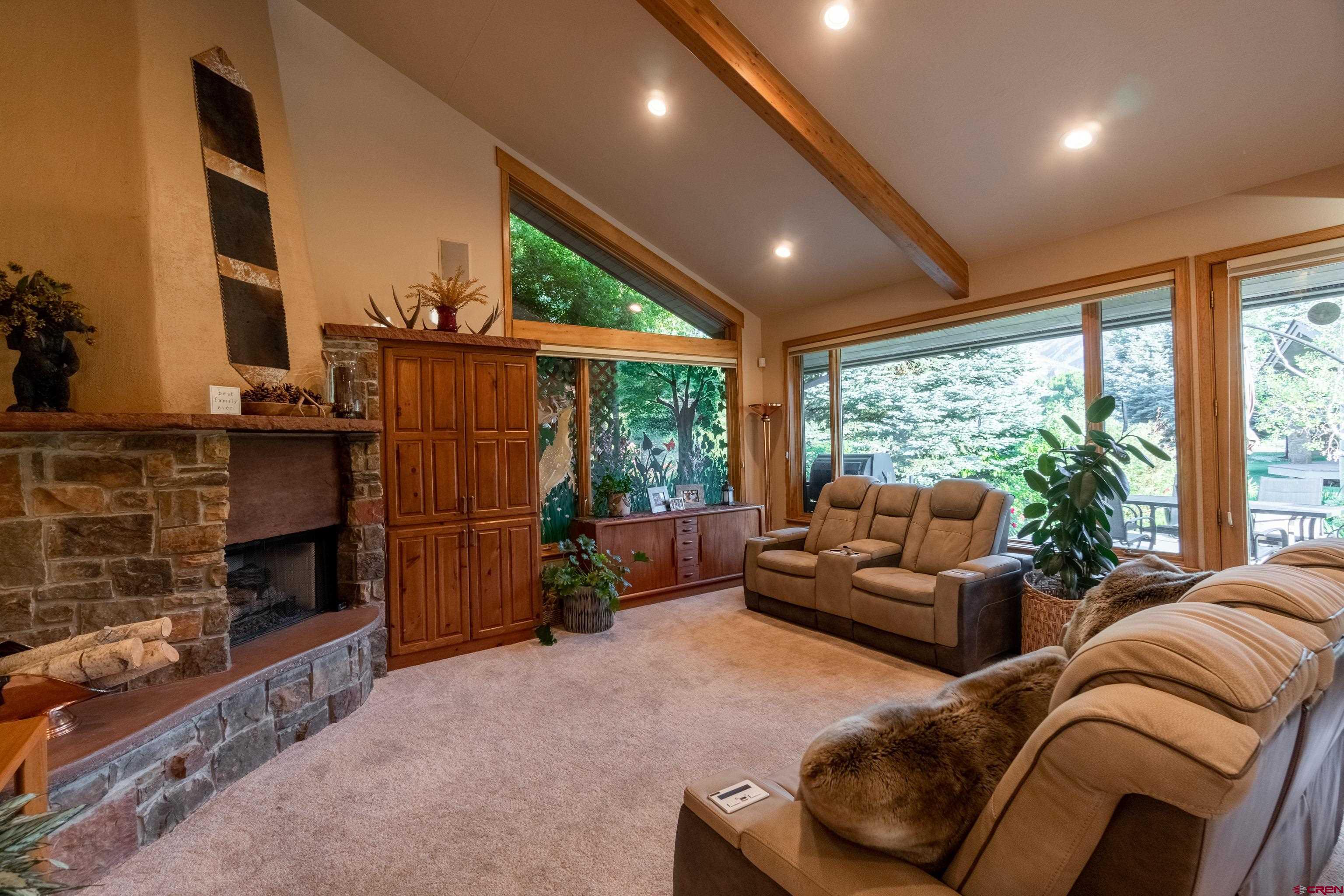 104 River Run Durango, CO 81301 - Photo 11 of 34 a living room with furniture and a fireplace