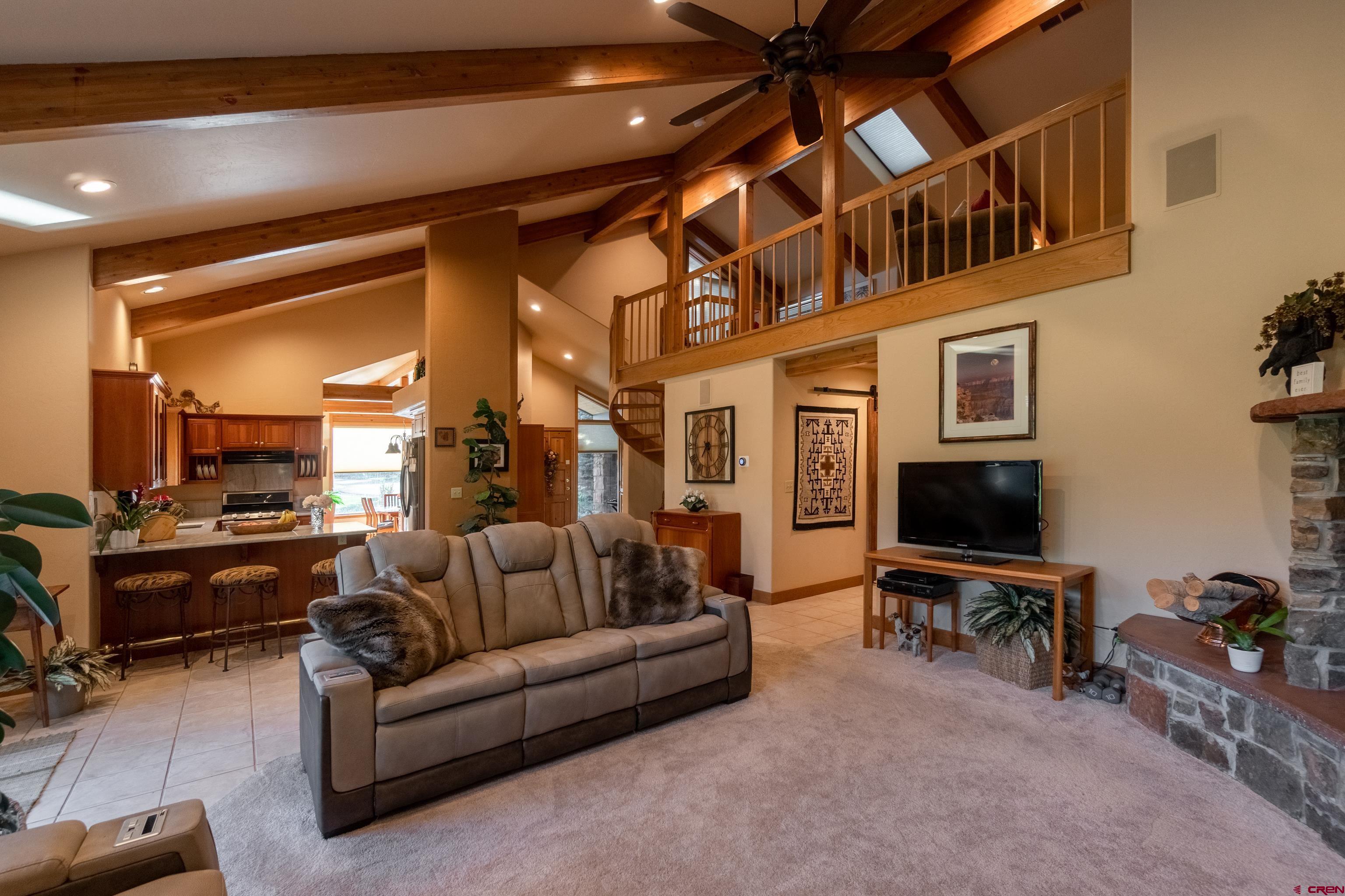 104 River Run Durango, CO 81301 - Photo 12 of 34 a living room with furniture and a flat screen tv