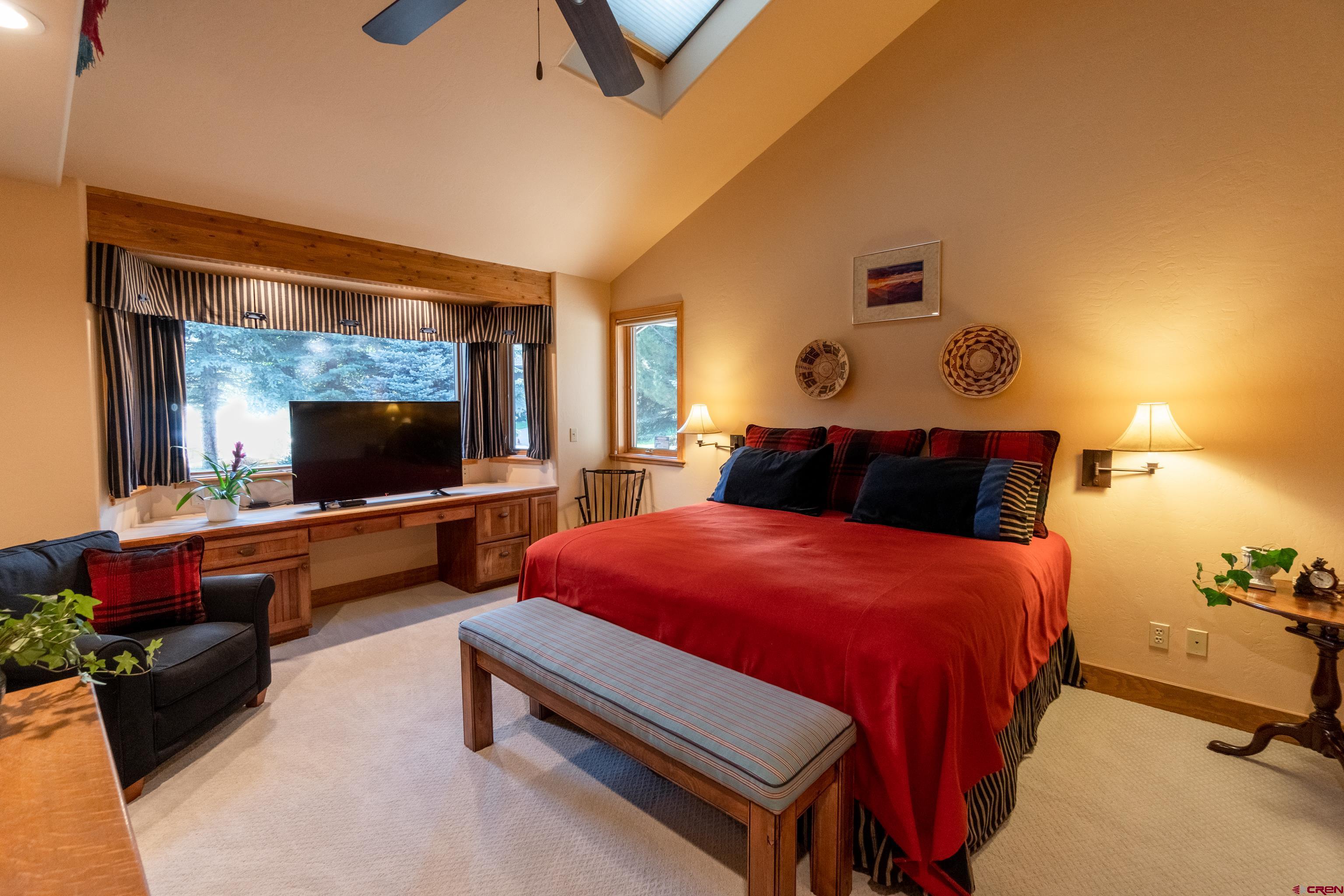 104 River Run Durango, CO 81301 - Photo 16 of 34 a bedroom with a bed and wooden floor