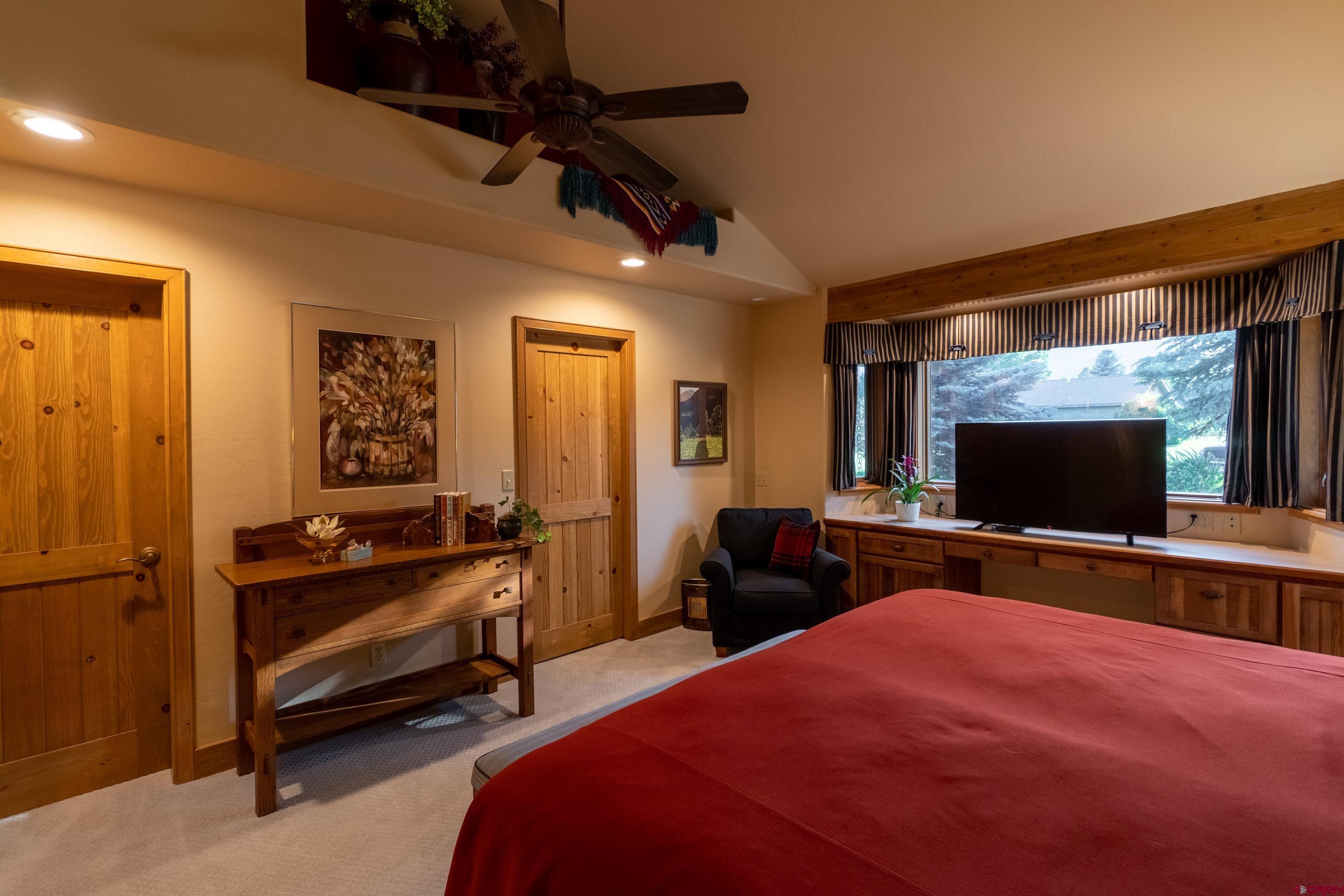 104 River Run Durango, CO 81301 - Photo 17 of 34 a bedroom with furniture and a flat screen tv