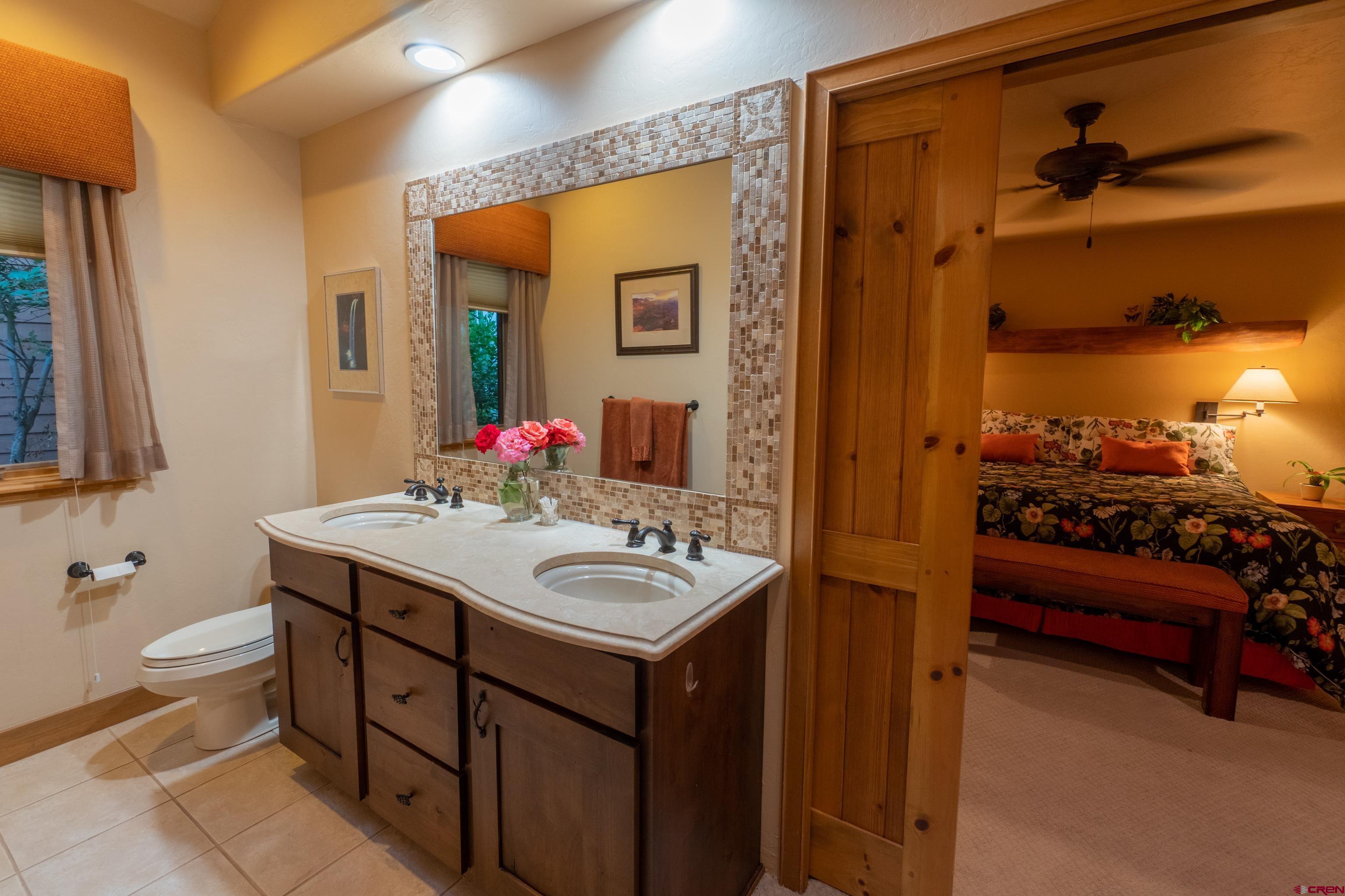 104 River Run Durango, CO 81301 - Photo 20 of 34 a bathroom with a sink and a mirror