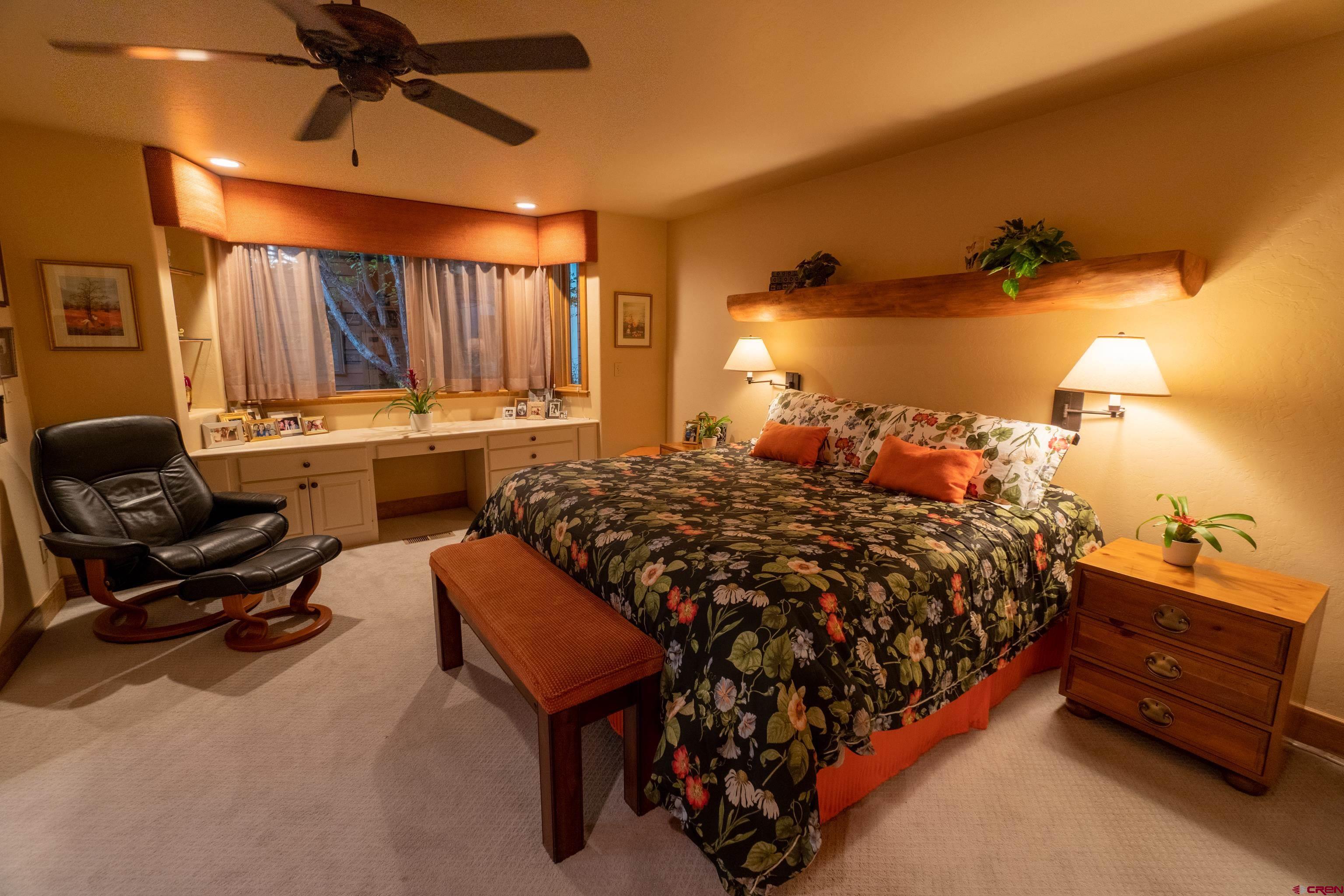 104 River Run Durango, CO 81301 - Photo 21 of 34 a bed room with a bed and a chair