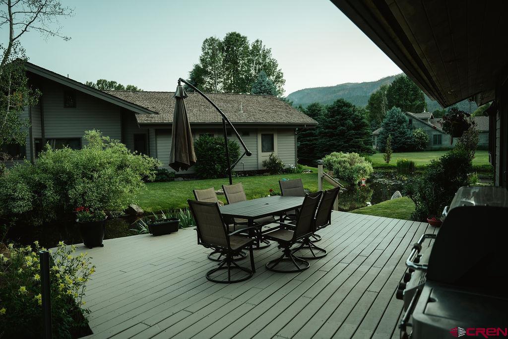 104 River Run Durango, CO 81301 - Photo 27 of 34 a view of a dinning table and chairs in patio of the house