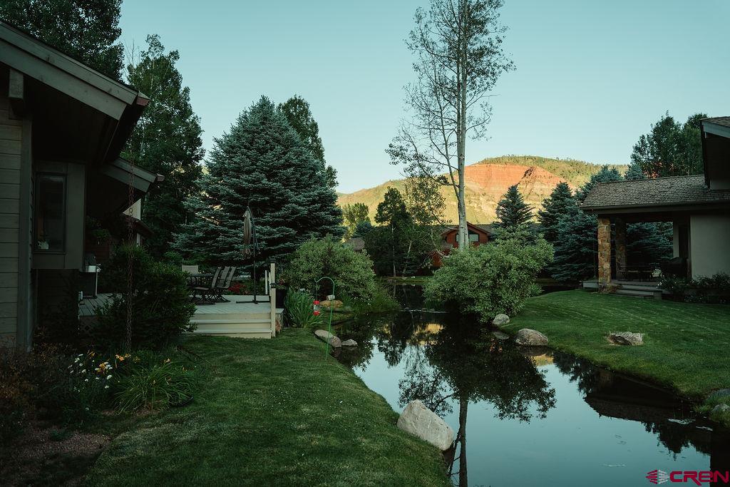 104 River Run Durango, CO 81301 - Photo 28 of 34 a view of a house with a yard and a fountain