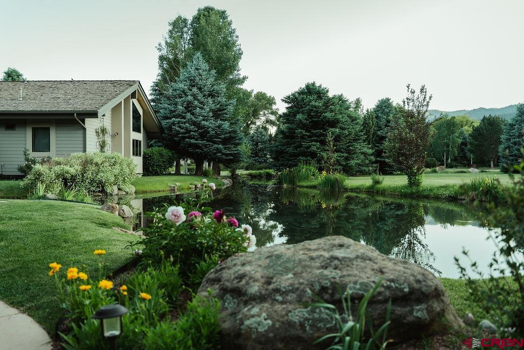 104 River Run Durango, CO 81301 - Photo 31 of 34 a view of a garden with a fountain