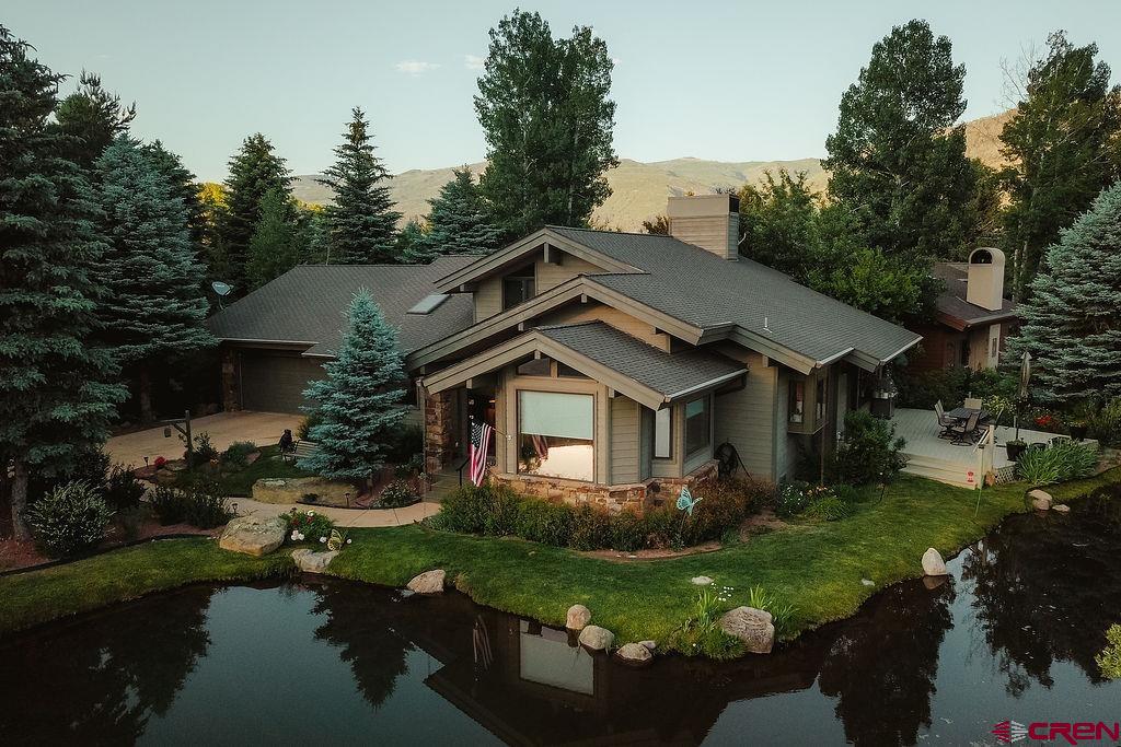 104 River Run Durango, CO 81301 - Photo 34 of 34 a front view of a house with a yard table and chairs